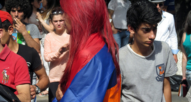 Girl with Armenian flag on her shoulders, protest action against hike in electricity prices, Yerevan, June 24, 2015. Photo by Tigran Petrosyan for the ‘Caucasian Knot’. Girl with Armenian flag on her shoulders, protest action against hike in electricity prices, Yerevan, June 24, 2015. Photo by Tigran Petrosyan for the ‘Caucasian Knot’.
