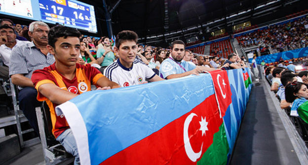 The spectators with the Azerbaijani flag at the I European Games. Baku, June 2015. Photo by Aziz Karimov for the "Caucasian Knot" The spectators with the Azerbaijani flag at the I European Games. Baku, June 2015. Photo by Aziz Karimov for the "Caucasian Knot"