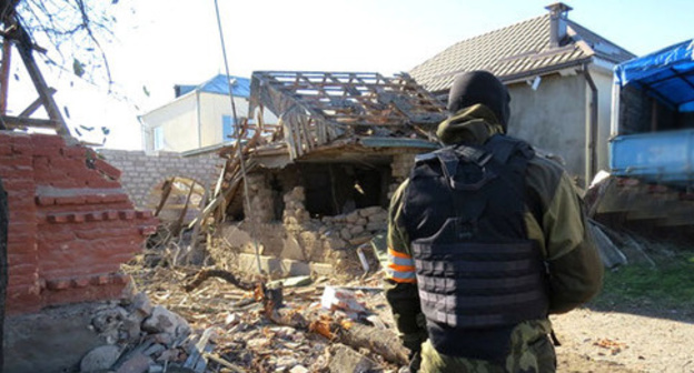 Law enforcer in front of the house destroyed during special operation, Chegem-Vtoroi village, Kabardino-Balkaria, November 2014. Photo: http://nac.gov.ru Law enforcer in front of the house destroyed during special operation, Chegem-Vtoroi village, Kabardino-Balkaria, November 2014. Photo: http://nac.gov.ru