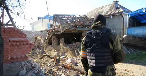 Law enforcer in front of the house destroyed during special operation, Chegem-Vtoroi village, Kabardino-Balkaria, November 2014. Photo: http://nac.gov.ru Law enforcer in front of the house destroyed during special operation, Chegem-Vtoroi village, Kabardino-Balkaria, November 2014. Photo: http://nac.gov.ru