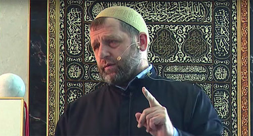 Khamzat Chumakov. Screenshot from the video of Khamzat Chumakov’s sermon (Khutba, July 31, 2015), http://ingislam.ru/video/homilies/homily_442.html Khamzat Chumakov. Screenshot from the video of Khamzat Chumakov’s sermon (Khutba, July 31, 2015), http://ingislam.ru/video/homilies/homily_442.html
