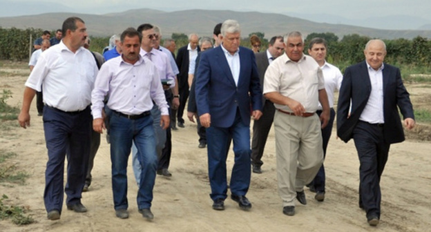 Khizri Shikhsaidov (in the centre) during his business trip to Derbent District of Dagestan. Photo: http://www.riadagestan.ru/mobile/news/derbentskiy_rayon/predsedatel_ns_rd_khizri_shikhsaidov_posetil_derbentskiy_rayon/#