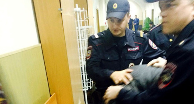 Law enforcers lead one of the defendants in the case of Nemtsov's murder through the corridor of the court. Moscow, April 23, 2015. Photo by Yuliya Buslavskaya for the "Caucasian Knot" Law enforcers lead one of the defendants in the case of Nemtsov's murder through the corridor of the court. Moscow, April 23, 2015. Photo by Yuliya Buslavskaya for the "Caucasian Knot"