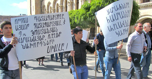 The relatives of the persons sentenced to life imprisonment demand to review their criminal cases. Inscriptions on the posters (to the right): "The judge of my son is now the convict himself", "Mr. Kostanyan (procurator general), fix the mistake of your forerunners". Yerevan, October 15, 2015. Photo by Tigran Petrosyan for the "Caucasian Knot" The relatives of the persons sentenced to life imprisonment demand to review their criminal cases. Inscriptions on the posters (to the right): "The judge of my son is now the convict himself", "Mr. Kostanyan (procurator general), fix the mistake of your forerunners". Yerevan, October 15, 2015. Photo by Tigran Petrosyan for the "Caucasian Knot"