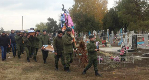 Burial of Vadim Kostenko. Photo: Sergey Khazov-Kassiya,  RFE/ RL, http://www.svoboda.org/content/article/27332224.html