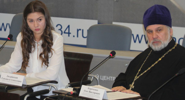 Archpriest Oleg Kirichenko, Chairman of the committee on the harmonization of interethnic and interreligious relations of the Public Chamber of the Volgograd Region, and Elizaveta Dzhurinskaya at the roundtable on the topic "Prevention of extremism among young people". Volgograd, November 18, 2015. Photo http://miatz.ru/news/62560/ Archpriest Oleg Kirichenko, Chairman of the committee on the harmonization of interethnic and interreligious relations of the Public Chamber of the Volgograd Region, and Elizaveta Dzhurinskaya at the roundtable on the topic "Prevention of extremism among young people". Volgograd, November 18, 2015. Photo http://miatz.ru/news/62560/