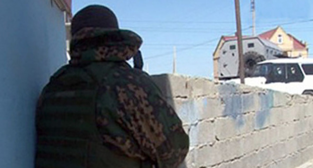 Law enforcer during CTO. Photo: http://afftor.kz/20301-v-odnom-iz-sel-kbr-vveli-rezhim-kto.html Law enforcer during CTO. Photo: http://afftor.kz/20301-v-odnom-iz-sel-kbr-vveli-rezhim-kto.html