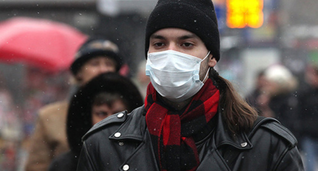 A young man in a surgical mask. Photo: Sputnik/ Yevgeny Biyatov, http://sputnik-georgia.ru/society/20160127/229923227.html A young man in a surgical mask. Photo: Sputnik/ Yevgeny Biyatov, http://sputnik-georgia.ru/society/20160127/229923227.html