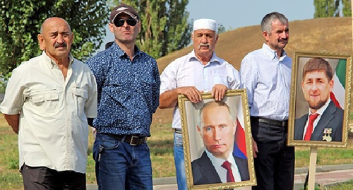The residents of Chechnya carry photos of Vladimir Putin and Ramzan Kadyrov during the celebration of the Republic Day. September 6, 2014. Photo by Magomed Magomedov for the "Caucasian Knot" The residents of Chechnya carry photos of Vladimir Putin and Ramzan Kadyrov during the celebration of the Republic Day. September 6, 2014. Photo by Magomed Magomedov for the "Caucasian Knot"