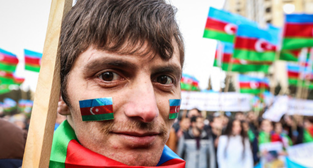 The participant of the anti-crisis rally in Baku. March 15, 2015. Photo by Aziz Karimov for the "Caucasian Knot" The participant of the anti-crisis rally in Baku. March 15, 2015. Photo by Aziz Karimov for the "Caucasian Knot"