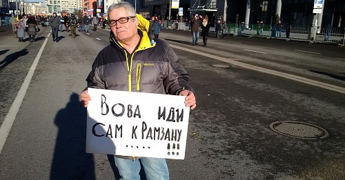 Moscovite Mikhail takes part in the rally in memory of Boris Nemtsov with poster saying: ‘Vova, go to Ramzan yourself!’, Sakharov Prospect, Moscow, February 27, 2016. Photo by Grigory Shvedov for the ‘Caucasian Knot’. Moscovite Mikhail takes part in the rally in memory of Boris Nemtsov with poster saying: ‘Vova, go to Ramzan yourself!’, Sakharov Prospect, Moscow, February 27, 2016. Photo by Grigory Shvedov for the ‘Caucasian Knot’.
