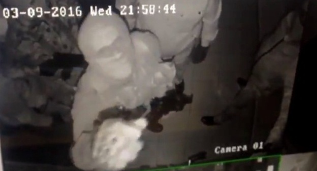 Attackers on the JMG office in Ingushetia. Screenshot of a video from the surveillance camera published in Dmitry Utukin's Twitter, Twitter.com/U2_Keen Attackers on the JMG office in Ingushetia. Screenshot of a video from the surveillance camera published in Dmitry Utukin's Twitter, Twitter.com/U2_Keen