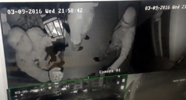 Attackers on the JMG office in Ingushetia. Screenshot of a video from the surveillance camera published in Dmitry Utukin's Twitter, Twitter.com/U2_Keen Attackers on the JMG office in Ingushetia. Screenshot of a video from the surveillance camera published in Dmitry Utukin's Twitter, Twitter.com/U2_Keen
