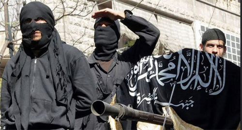 IS supporters hold Islamic State flag (Islamic State is a terrorist organization banned in Russia). Photo by user Chief Editor, www.flickr.com IS supporters hold Islamic State flag (Islamic State is a terrorist organization banned in Russia). Photo by user Chief Editor, www.flickr.com