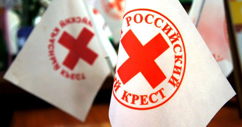 Flags with logo of International Red Cross. Photo: http://www.novorosinform.org/news/id/29120 Flags with logo of International Red Cross. Photo: http://www.novorosinform.org/news/id/29120