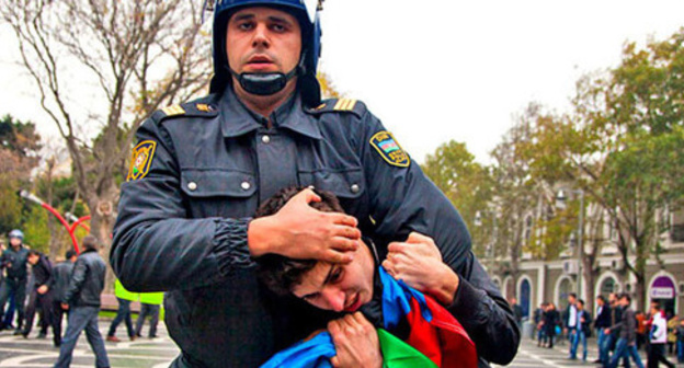 A policeman detains an activist at the protest action. Baku, Novermber 17, 2012. Photo by Aziz Karimov for the "Caucasian Knot" A policeman detains an activist at the protest action. Baku, Novermber 17, 2012. Photo by Aziz Karimov for the "Caucasian Knot"