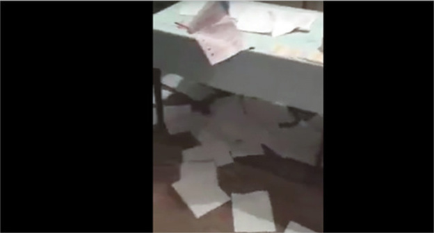 Trampled down ballot papers at the polling station in the village of Gotsatl. Screenshot of a video from the "Dagestan Online" community on Facebook, facebook.com/groups/dagonline Trampled down ballot papers at the polling station in the village of Gotsatl. Screenshot of a video from the "Dagestan Online" community on Facebook, facebook.com/groups/dagonline