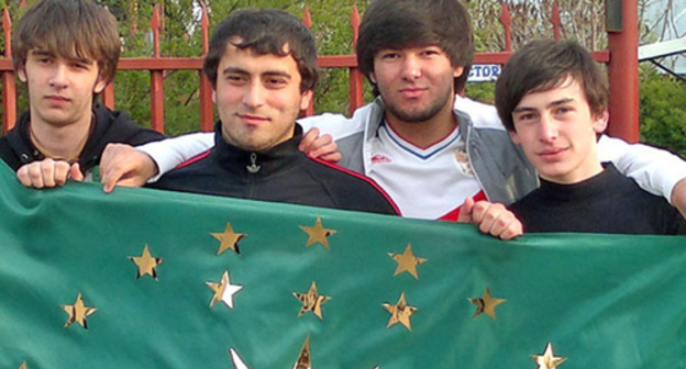 Young people holding a Circassian flag. Photo by the "Caucasian Knot" correspondent Asya Kapaeva Young people holding a Circassian flag. Photo by the "Caucasian Knot" correspondent Asya Kapaeva