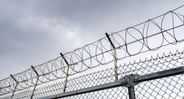 A prison fence. Photo: Thinkstock/Fotobank.ru A prison fence. Photo: Thinkstock/Fotobank.ru
