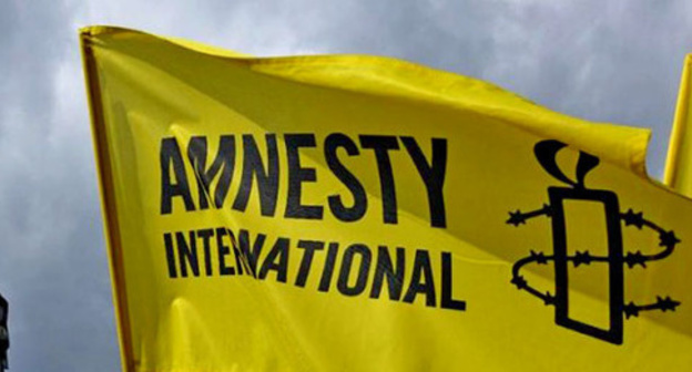 Flag with Amnesty International logo. Photo: http://haqqin.az/news/83912 Flag with Amnesty International logo. Photo: http://haqqin.az/news/83912