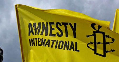 Flag with Amnesty International logo. Photo: http://haqqin.az/news/83912 Flag with Amnesty International logo. Photo: http://haqqin.az/news/83912