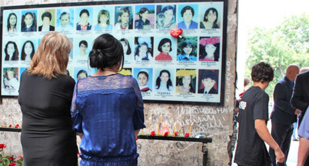 Photos of the terror act victims on the wall of the gym at school No. 1. Beslan. Photo by Emma Marzoeva for the "Caucasian Knot"
