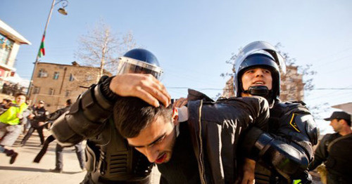 Policemen detain rally participant. Photo: http://haqqin.az/news/88222 Policemen detain rally participant. Photo: http://haqqin.az/news/88222