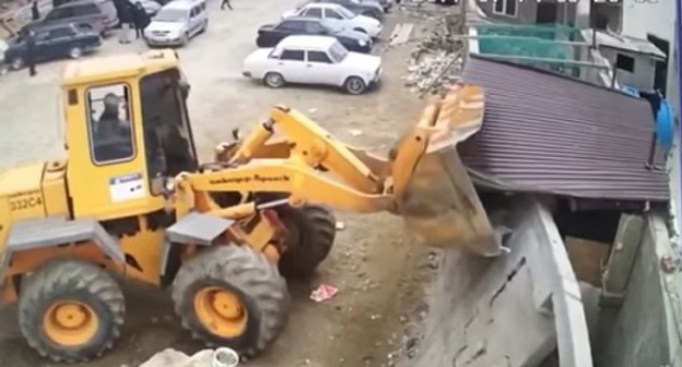 Demolition of fence in Separatorny village in Makhachkala. Screenshot of video, https://www.youtube.com/watch?v=RywuclnP13w Demolition of fence in Separatorny village in Makhachkala. Screenshot of video, https://www.youtube.com/watch?v=RywuclnP13w