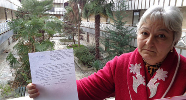 The 10-member Manukov household head shows an application with a request not to evict the family and switch off power supply. Photo by Svetlana Kravchenko for the "Caucasian Knot" The 10-member Manukov household head shows an application with a request not to evict the family and switch off power supply. Photo by Svetlana Kravchenko for the "Caucasian Knot"