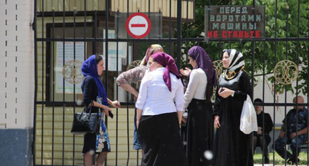 School graduates near the gate of the Unified State Examination centre. Grozny, May 2015. Photo by Magomed Magomedov for the "Caucasian Knot" School graduates near the gate of the Unified State Examination centre. Grozny, May 2015. Photo by Magomed Magomedov for the "Caucasian Knot"