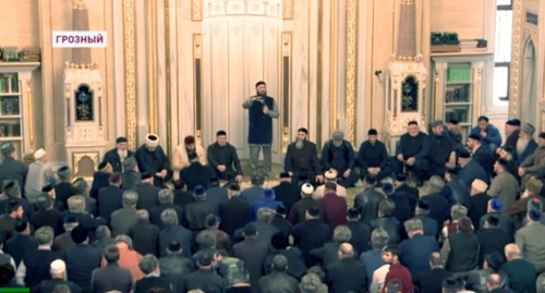 Meeting at the central mosque of Grozny. Screenshot of video reportage by Grozny TV, youtube.com/watch?v=X9y33aVauUI Meeting at the central mosque of Grozny. Screenshot of video reportage by Grozny TV, youtube.com/watch?v=X9y33aVauUI