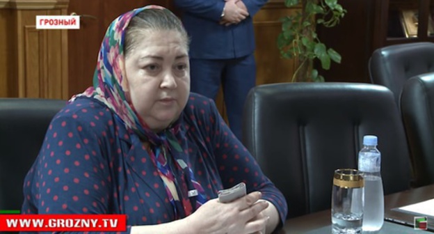 Yakha Beksultanova at the meeting with the officials of the city administration and the republic in the Mayoralty of Grozny. Screenshot of a video https://www.youtube.com/watch?v=AsAjQrf_tmk Yakha Beksultanova at the meeting with the officials of the city administration and the republic in the Mayoralty of Grozny. Screenshot of a video https://www.youtube.com/watch?v=AsAjQrf_tmk