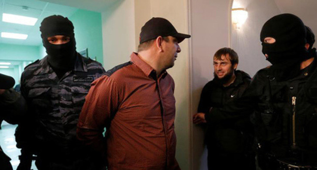 Tamerlan Eskerkhanov, Maxim Zmeev under convoy. Photo REUTERS Tamerlan Eskerkhanov, Maxim Zmeev under convoy. Photo REUTERS