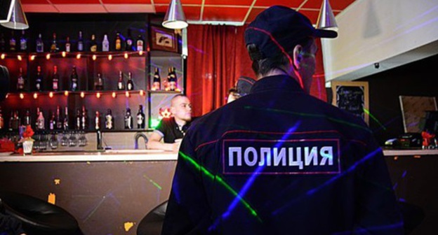 Policeman in a bar. Photo by Maria Mayer, IA 'Komiinform' Policeman in a bar. Photo by Maria Mayer, IA 'Komiinform'