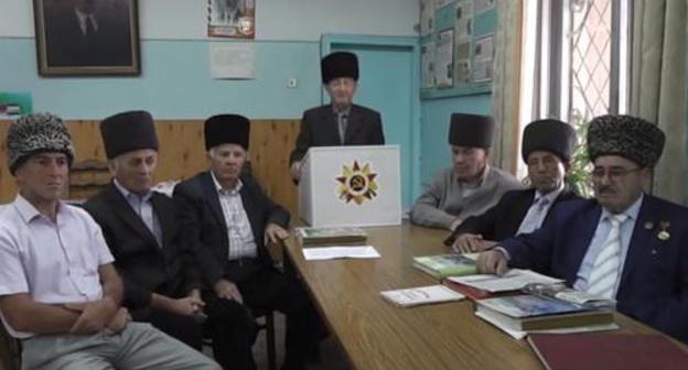 Baksan elders. Screenshot of video at: https://www.youtube.com/watch?v=4GKaLaWvHqI Baksan elders. Screenshot of video at: https://www.youtube.com/watch?v=4GKaLaWvHqI