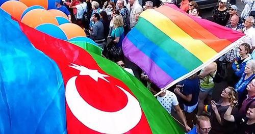 Flag of Azerbaijan and Rainbow flag at rally in Hamburg. Photo: Nefes LGBT Azerbaijan Alliance Flag of Azerbaijan and Rainbow flag at rally in Hamburg. Photo: Nefes LGBT Azerbaijan Alliance
