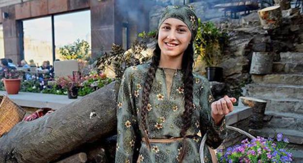 A young woman wearing Georgian costume at Tbilisoba Festival. Photo: © Sputnik / Alexander Imedashvili A young woman wearing Georgian costume at Tbilisoba Festival. Photo: © Sputnik / Alexander Imedashvili