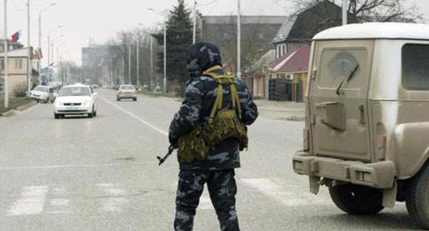 A law enforcer. Photo: REUTERS/MAXIM SHEMETOV A law enforcer. Photo: REUTERS/MAXIM SHEMETOV