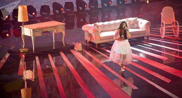 Performance of Polina Bogusevich. Photo: Denis Aslanov, Sputnik, https://sputnik-georgia.ru/culture/20171126/238321885/Pobeditelem-Detskogo-Evrovidenija-2017-v-Tbilisi-stala-Rossija.html Performance of Polina Bogusevich. Photo: Denis Aslanov, Sputnik, https://sputnik-georgia.ru/culture/20171126/238321885/Pobeditelem-Detskogo-Evrovidenija-2017-v-Tbilisi-stala-Rossija.html
