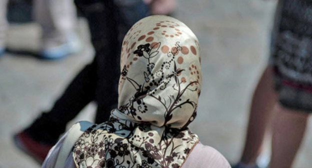 A girl wearing a headscarf. Photo by ther user Daniele Febei https://www.flickr.com A girl wearing a headscarf. Photo by ther user Daniele Febei https://www.flickr.com