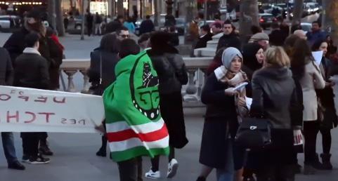 Chechen emigrants at the memorial action held in the center of Paris, France. Photo: screenshot of the video by "Krym. Realii", https://ru.krymr.com/a/28328651.html Chechen emigrants at the memorial action held in the center of Paris, France. Photo: screenshot of the video by "Krym. Realii", https://ru.krymr.com/a/28328651.html