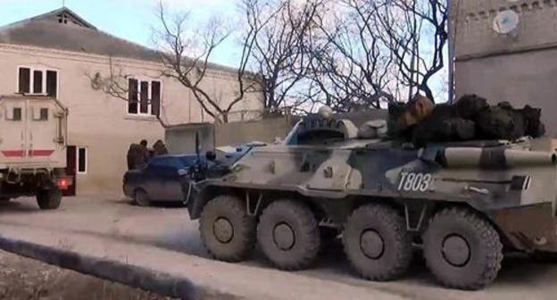 Military vehicles during the special operation. Photo by the press service of Russia's National Anti-Terrorism Committee http://nac.gov.ru/kontrterroristicheskie-operacii/v-dagestane-v-hode-kto-neytralizovany-troe.html Military vehicles during the special operation. Photo by the press service of Russia's National Anti-Terrorism Committee http://nac.gov.ru/kontrterroristicheskie-operacii/v-dagestane-v-hode-kto-neytralizovany-troe.html