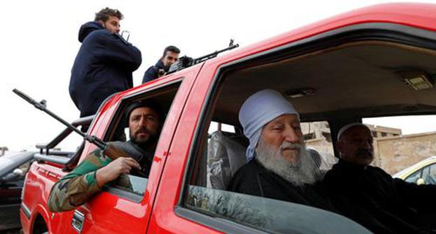 Armed people in Syria. Photo REUTERS OMAR SANADIKI Armed people in Syria. Photo REUTERS OMAR SANADIKI