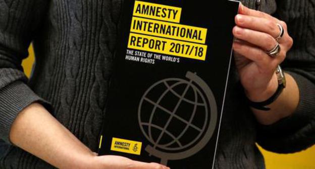The report of the Amnesty International. Photo: REUTERS/Bobby Yip The report of the Amnesty International. Photo: REUTERS/Bobby Yip