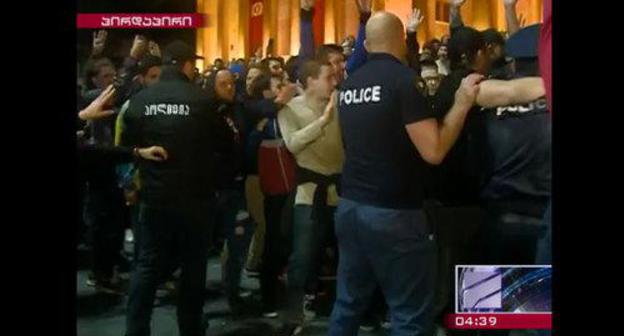 Policemen and protesters in Tbilisi. May 12, 2018. Photo: screenshot of a video by the "Rustavi-2" TV Channel http://rustavi2.ge/en/news/103763 Policemen and protesters in Tbilisi. May 12, 2018. Photo: screenshot of a video by the "Rustavi-2" TV Channel http://rustavi2.ge/en/news/103763