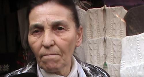 Seller at the Sheep Wool market in Nalchik. Screenshot from video: https://www.youtube.com/watch?time_continue=277&v=WLwj5-d8ldE Seller at the Sheep Wool market in Nalchik. Screenshot from video: https://www.youtube.com/watch?time_continue=277&v=WLwj5-d8ldE