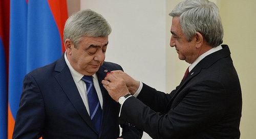 Serzh Sargsyan, a President of Armenia, gives an award to his brother Levon Sargsyan. Photo by the press service of the President of Armenia http://www.president.am Serzh Sargsyan, a President of Armenia, gives an award to his brother Levon Sargsyan. Photo by the press service of the President of Armenia http://www.president.am