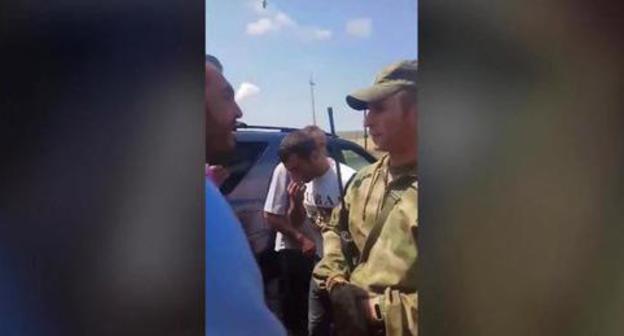 Russian serviceman talks to residents of Panik village, July 18, 2018. Screenshot from video: https://www.facebook.com/100002121814208/videos/vb.100002121814208/1770571256356918/?type=2&video_source=user_video_tab Russian serviceman talks to residents of Panik village, July 18, 2018. Screenshot from video: https://www.facebook.com/100002121814208/videos/vb.100002121814208/1770571256356918/?type=2&video_source=user_video_tab
