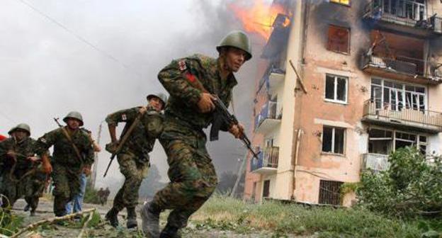 Georgian soldiers in Gori after Russia's bombing of a residential block. August 9, 2008. Photo: REUTERS/Gleb Garanich Georgian soldiers in Gori after Russia's bombing of a residential block. August 9, 2008. Photo: REUTERS/Gleb Garanich