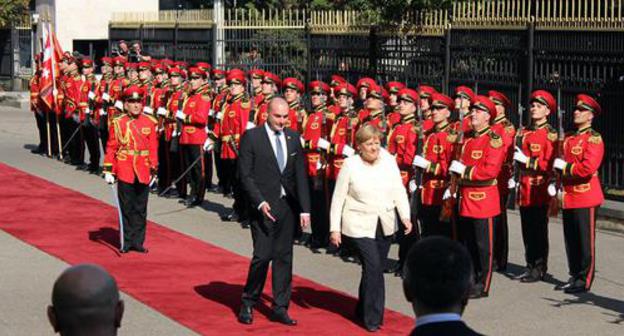 The German Chancellor Angela Merkel and the Prime Minister of Georgia Mamuka Bakhtadze. Photo by Inna Kukudjanova for the "Caucasian Knot" The German Chancellor Angela Merkel and the Prime Minister of Georgia Mamuka Bakhtadze. Photo by Inna Kukudjanova for the "Caucasian Knot"
